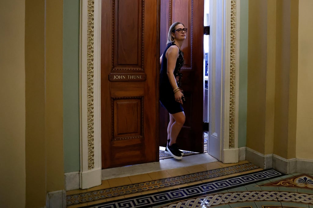 US Senator Kyrsten Sinema leaves Republican Whip John Thune’s office on Thursday amid wrangling over the coming vote on debt ceiling legislation. Photo: Reuters US Senator Kyrsten Sinema leaves Republican Whip John Thune’s office on Thursday amid wrangling over the coming vote on debt ceiling legislation. Photo: Reuters