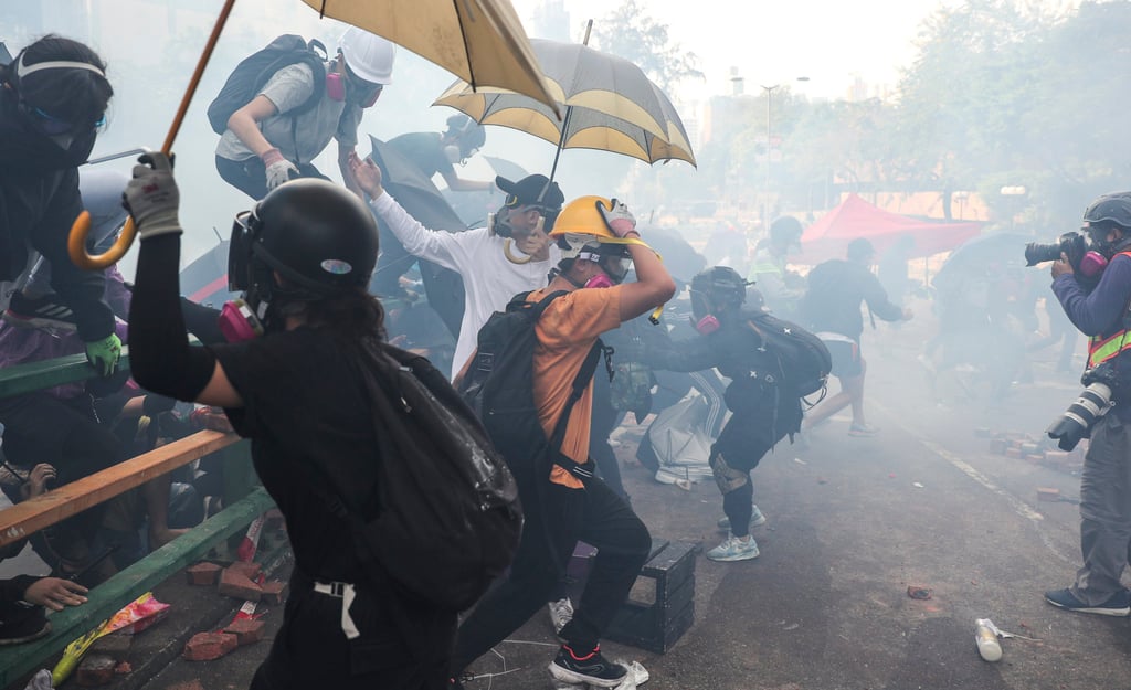 Anti-government protesters retreat from police at Polytechnic University during the 2019 siege of the Hung Hom campus. Photo: Sam Tsang