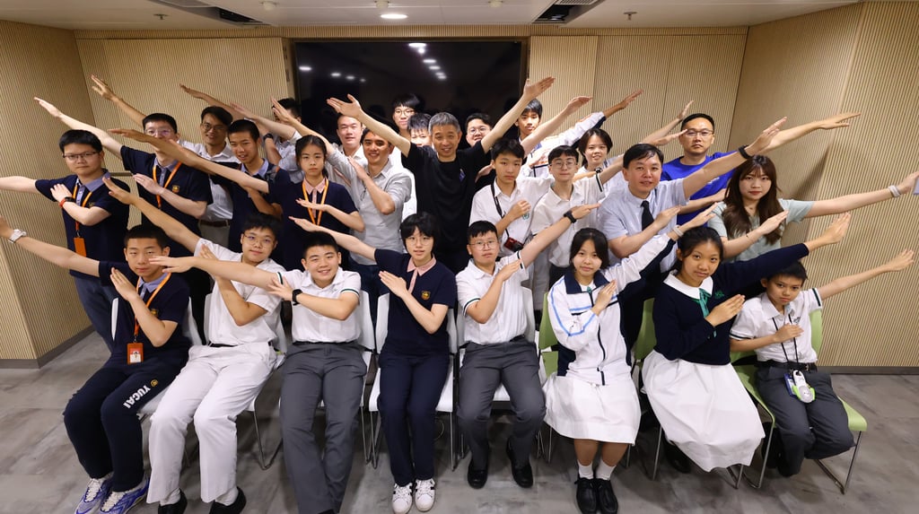 Alibaba Cloud founder Wang Jian (second row, centre) poses with Hong Kong schoolchildren. Photo: Dickson Lee Alibaba Cloud founder Wang Jian (second row, centre) poses with Hong Kong schoolchildren. Photo: Dickson Lee