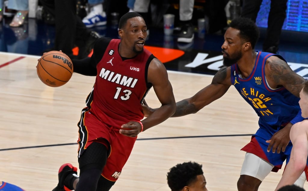 Miami Heat centre Bam Adebayo (left) drives the ball past Denver Nuggets forward Jeff Green. Photo: EPA-EFE