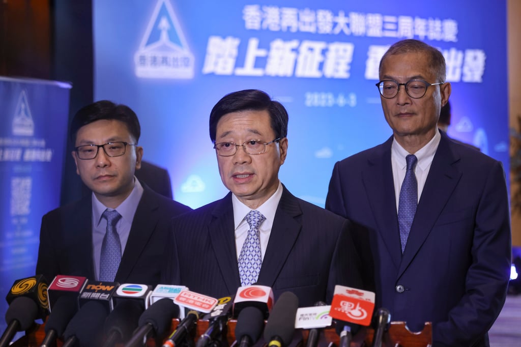 City leader John Lee (centre) speaks to the media on Saturday, flanked by labour and welfare chief Chris Sun Yuk-han (left) and Secretary for Health Lo Chung-mau. Photo: Jonathan Wong