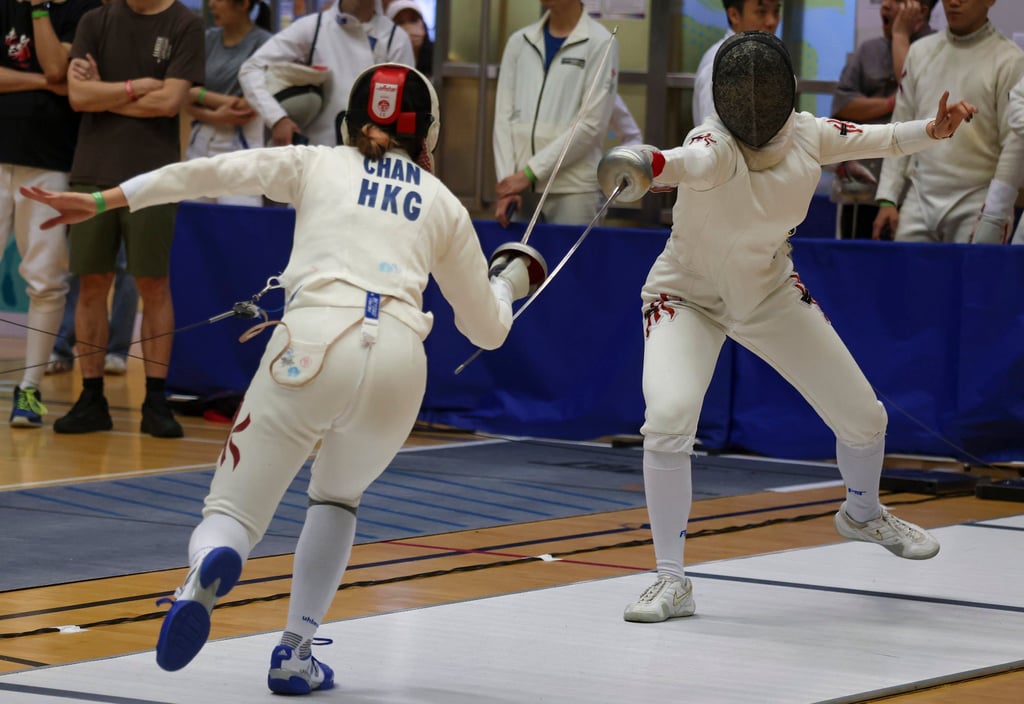 Kaylin Hsieh Sin-yan (right) vs Chan On-sang at the LCSD Open Fencing Championships, at Hong Kong Park Sports Centre in Admiralty. Photo: Jonathan Wong