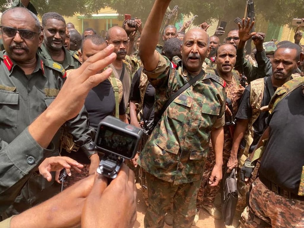 Sudan’s General Abdel Fattah al-Burhan stands among troops in an unknown location. Photo: Sudanese Armed Forces / Handout via Reuters Sudan’s General Abdel Fattah al-Burhan stands among troops in an unknown location. Photo: Sudanese Armed Forces / Handout via Reuters
