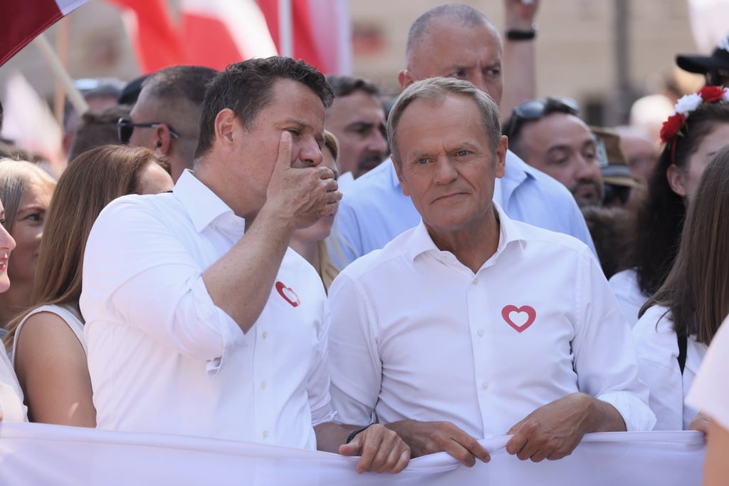 Leader of main opposition party Civic Platform Donald Tusk, right, and Warsaw mayor Rafal Trzaskowski take part in the ‘4th June March’ in Warsaw, Poland on Sunday. Photo: EPA-EFE