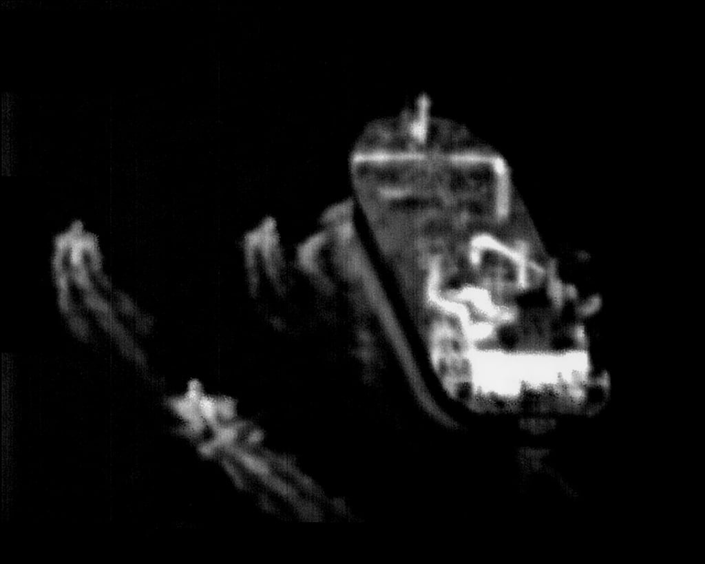 Three Iranian Revolutionary Guard fast-attack vessels near a commercial ship in this still image taken from surveillance video from a US Navy Boeing P-8 Poseidon. photo: US Navy via AP Three Iranian Revolutionary Guard fast-attack vessels near a commercial ship in this still image taken from surveillance video from a US Navy Boeing P-8 Poseidon. photo: US Navy via AP
