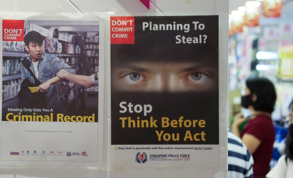 Anti-shoplifting posters in a Singapore mall. Photo: Shutterstock