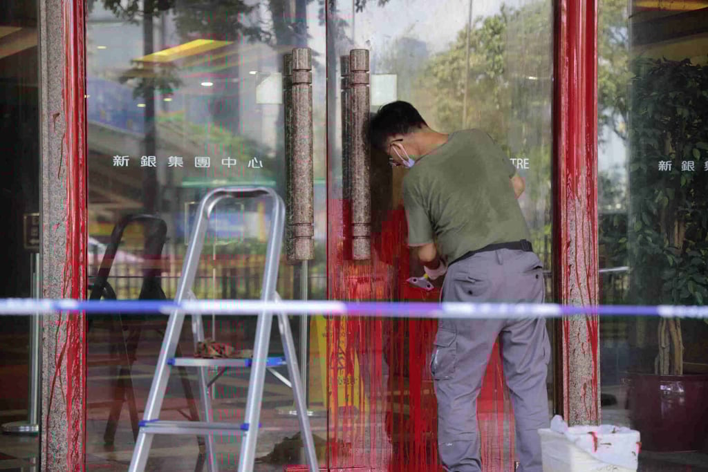 Red paint was poured on the glass door of a commercial building on Gloucester Road in Wan Chai. BYD’s showroom is next to the entrance. Photo: Jelly Tse Red paint was poured on the glass door of a commercial building on Gloucester Road in Wan Chai. BYD’s showroom is next to the entrance. Photo: Jelly Tse