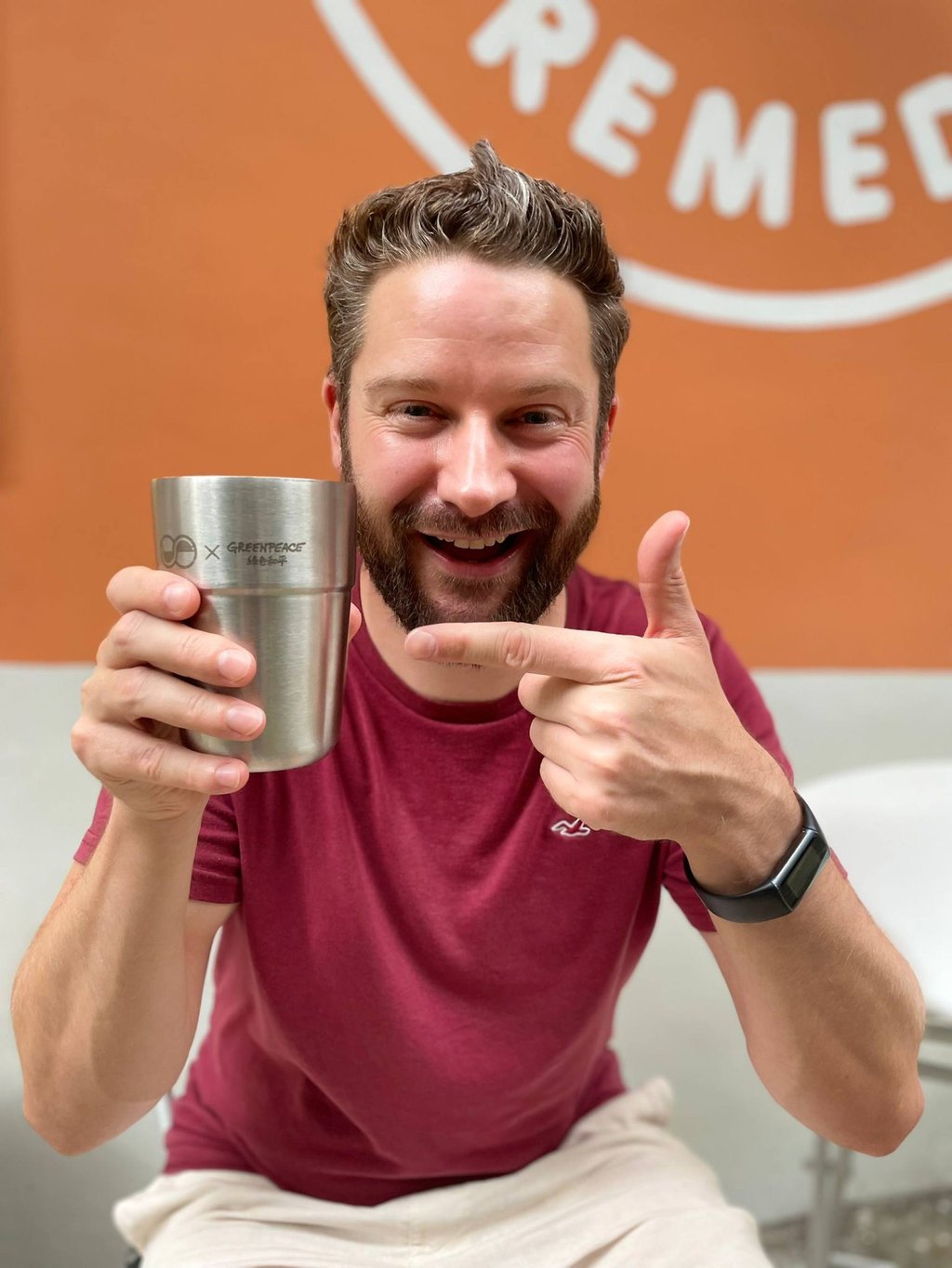 Tim Parker shows off one of his company’s steel coffee cups. Photo: Handout