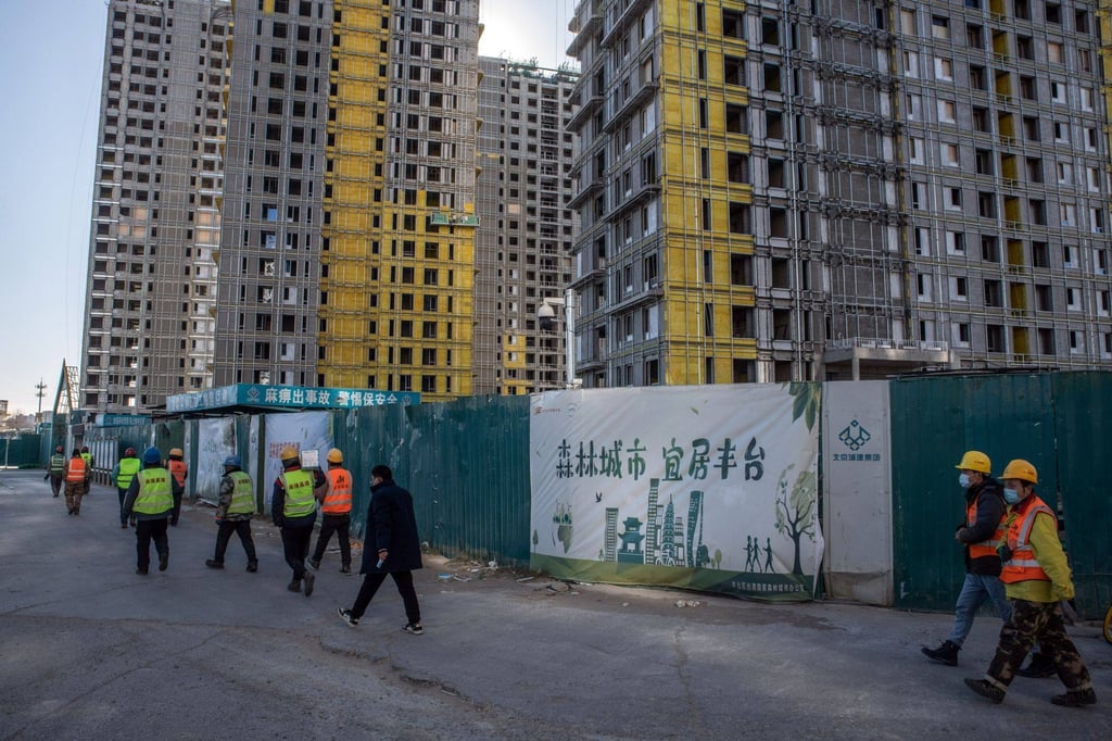 Residential buildings under construction at the Honor of China project in Beijing in December 2022. The project was sold to state-owned China Resources Land by Shimao Group Holdings after it defaulted on its debt. Photo: Bloomberg Residential buildings under construction at the Honor of China project in Beijing in December 2022. The project was sold to state-owned China Resources Land by Shimao Group Holdings after it defaulted on its debt. Photo: Bloomberg