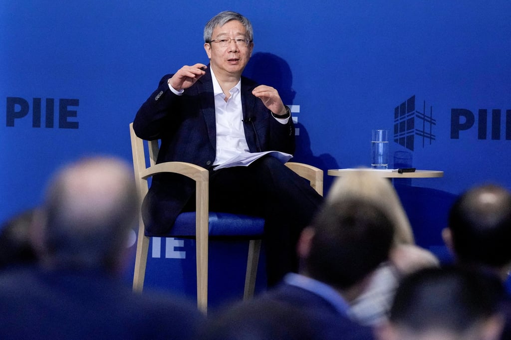 The People’s Bank of China governor Yi Gang speaks to the media in Washington in April 2023. Photo: Reuters
