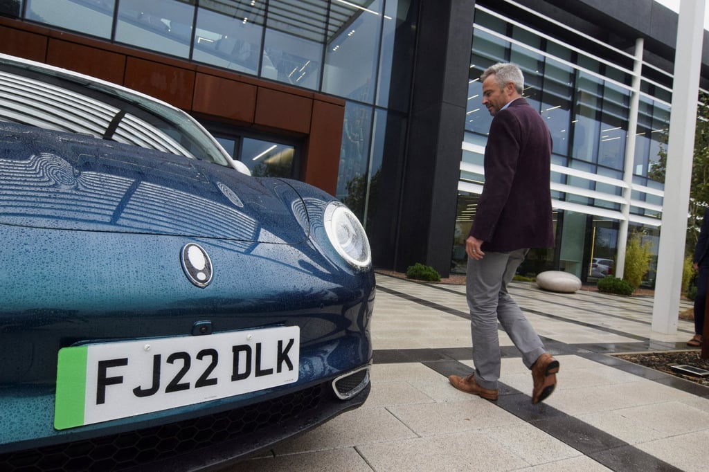 Toby Marshall, UK sales and marketing director for Chinese carmaker Great Wall Motor’s ORA brand, shows off the ORA Funky Cat hatchback ahead of its British launch in Solihull, Britain on October 5, 2022. Photo: Reuters