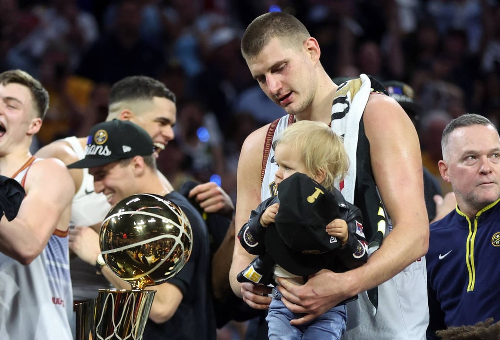 Nikola Jokic of the Denver Nuggets celebrates with his daughter Ognjena. Photo: AFP