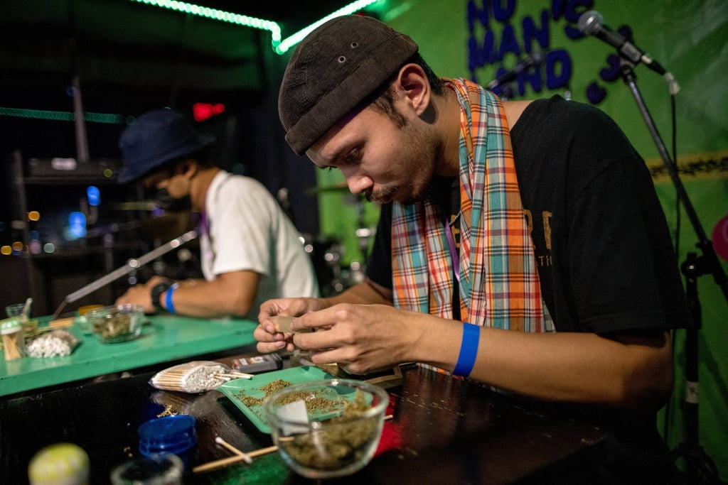 Participants take part in a joint rolling competition at the “Cannabis Cup Thailand” marijuana-based event at No Man’s Land dispensary in Bangkok in 2022. Photo: AFP Participants take part in a joint rolling competition at the “Cannabis Cup Thailand” marijuana-based event at No Man’s Land dispensary in Bangkok in 2022. Photo: AFP