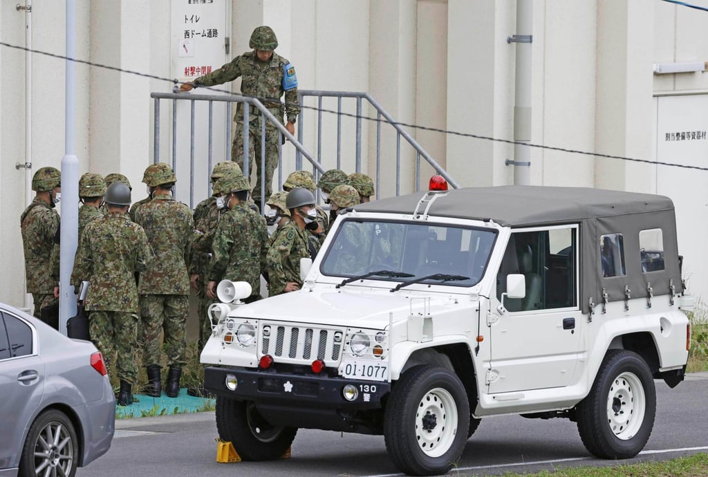 Japanese Self-Defence Force troops gather near a facility at the base firing range in Gifu, central Japan, on Wednesday. Photo: Kyodo News via AP Japanese Self-Defence Force troops gather near a facility at the base firing range in Gifu, central Japan, on Wednesday. Photo: Kyodo News via AP
