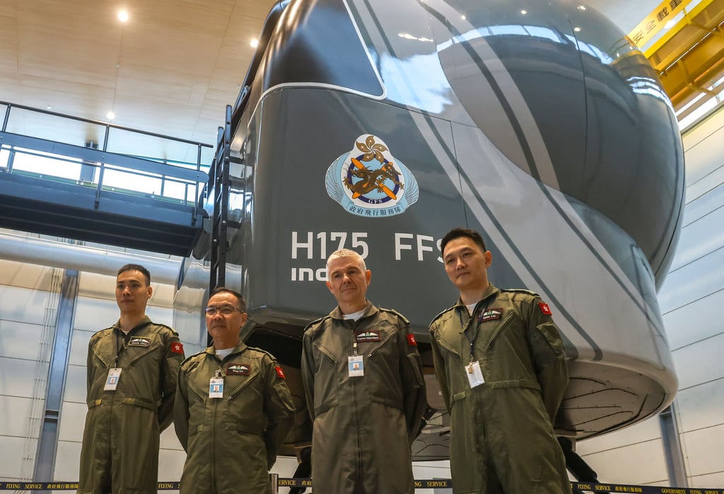 (From left) Senior pilot (helicopter standards) Eddie Liu, Government Flying Service controller West Wu, chief pilot (training and standards) Trevor Marshall and senior pilot (helicopter – technical support) Howie Chun with the organisation’s new simulator. Photo: Jonathan Wong (From left) Senior pilot (helicopter standards) Eddie Liu, Government Flying Service controller West Wu, chief pilot (training and standards) Trevor Marshall and senior pilot (helicopter – technical support) Howie Chun with the organisation’s new simulator. Photo: Jonathan Wong