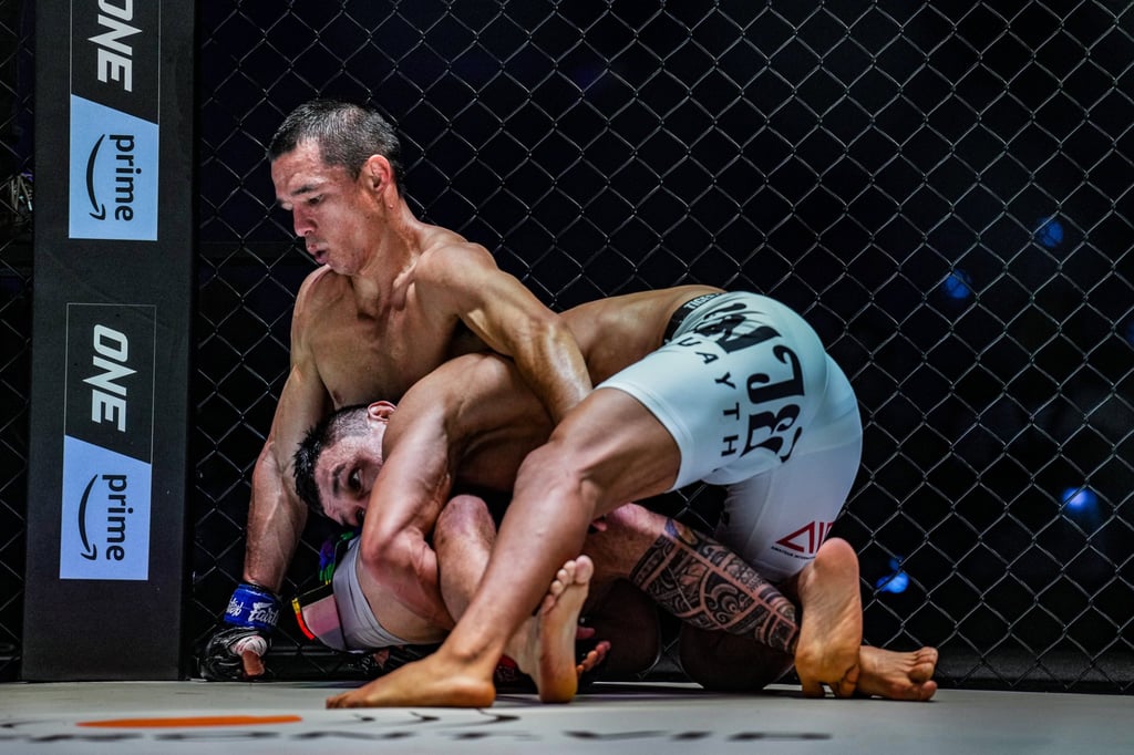 Kairat Akhmetov holds Reece McLaren against the fence at ONE Fight Night 10 in Denver. Kairat Akhmetov holds Reece McLaren against the fence at ONE Fight Night 10 in Denver.