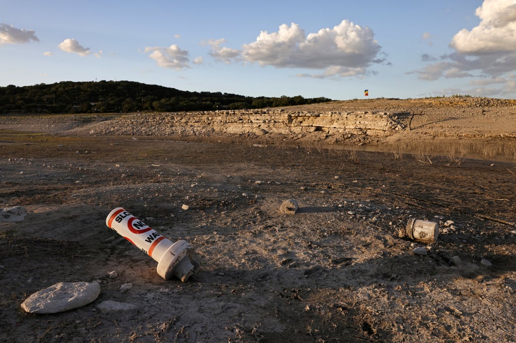 A buoy normally used to mark “No wake” zones sits on dry land at Medina Lake outside San Antonio on Sunday as the majority of Texas experiences drought. Photo: Reuters