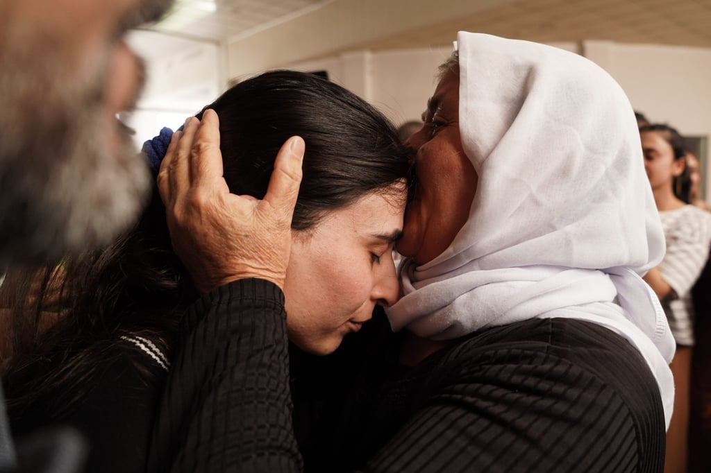 A young Yazidi woman is greeted by a family member after being rescued and returned to Kurdistan following captivity by Islamic State. Photo: dpa A young Yazidi woman is greeted by a family member after being rescued and returned to Kurdistan following captivity by Islamic State. Photo: dpa