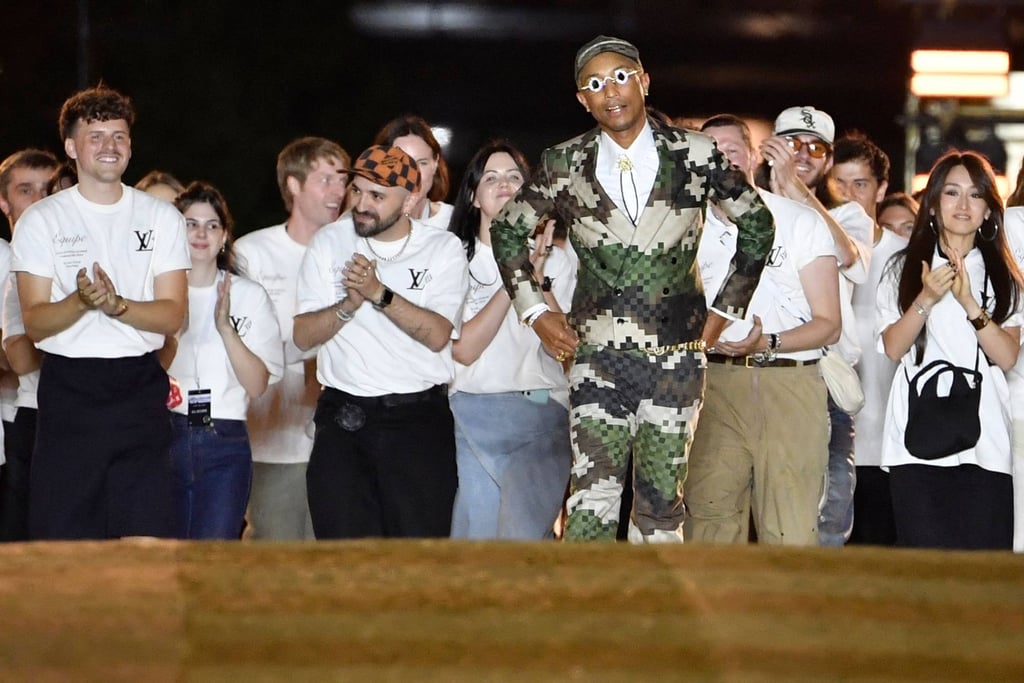 Pharrell Williams (centre) made a splash for his debut show as Louis Vuitton’s head of menswear during Paris Fashion Week on the Pont Neuf, central Paris, on June 20. Photo: AFP