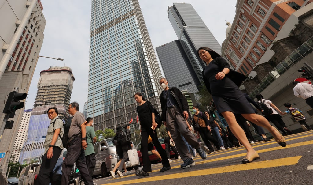 People crossing the road in Central on April 11. A quarter of Hong Kong’s workforce will be affected as applications such as ChatGPT penetrate a wide range of industries. Photo: Jelly Tse People crossing the road in Central on April 11. A quarter of Hong Kong’s workforce will be affected as applications such as ChatGPT penetrate a wide range of industries. Photo: Jelly Tse