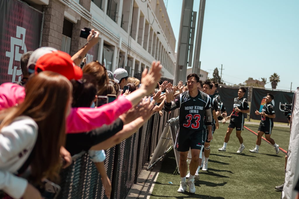 Captain Kelvin Mak Ho-chun leads Hong Kong’s team to greet the fans after Sunday’s win over Austria. Photo: Handout Captain Kelvin Mak Ho-chun leads Hong Kong’s team to greet the fans after Sunday’s win over Austria. Photo: Handout