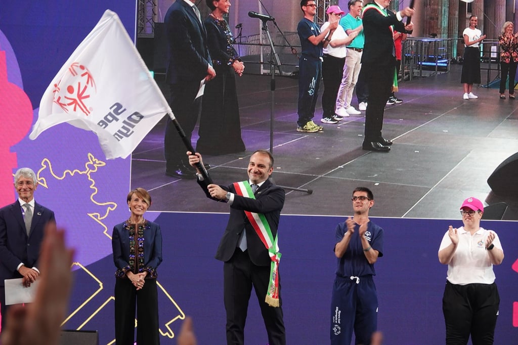 Stefano Lo Russo (centre), mayor of Italy’s Turin, waves the Special Olympic flag after it is handed over ahead of the next Games in 2025, which will take place in his city Photo: Xinhua