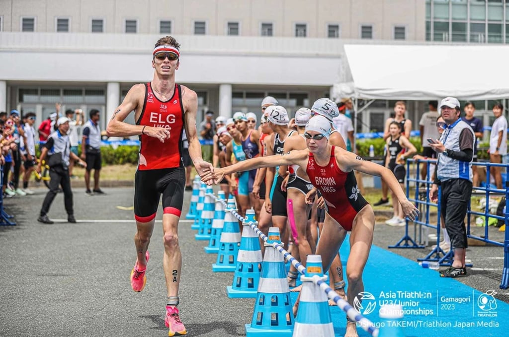 Bailee Brown (right) taking over from Robin Elg to start the second leg at the Mixed U23-Junior Relay for Team Hong Kong. Photo: Handout Bailee Brown (right) taking over from Robin Elg to start the second leg at the Mixed U23-Junior Relay for Team Hong Kong. Photo: Handout