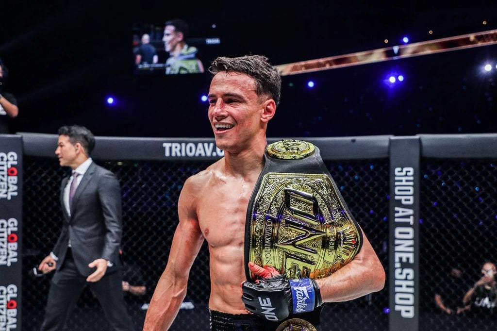 Joseph Lasiri poses with the ONE strawweight Muay Thai title after a win over Prajanchai. Photo: ONE Championship
