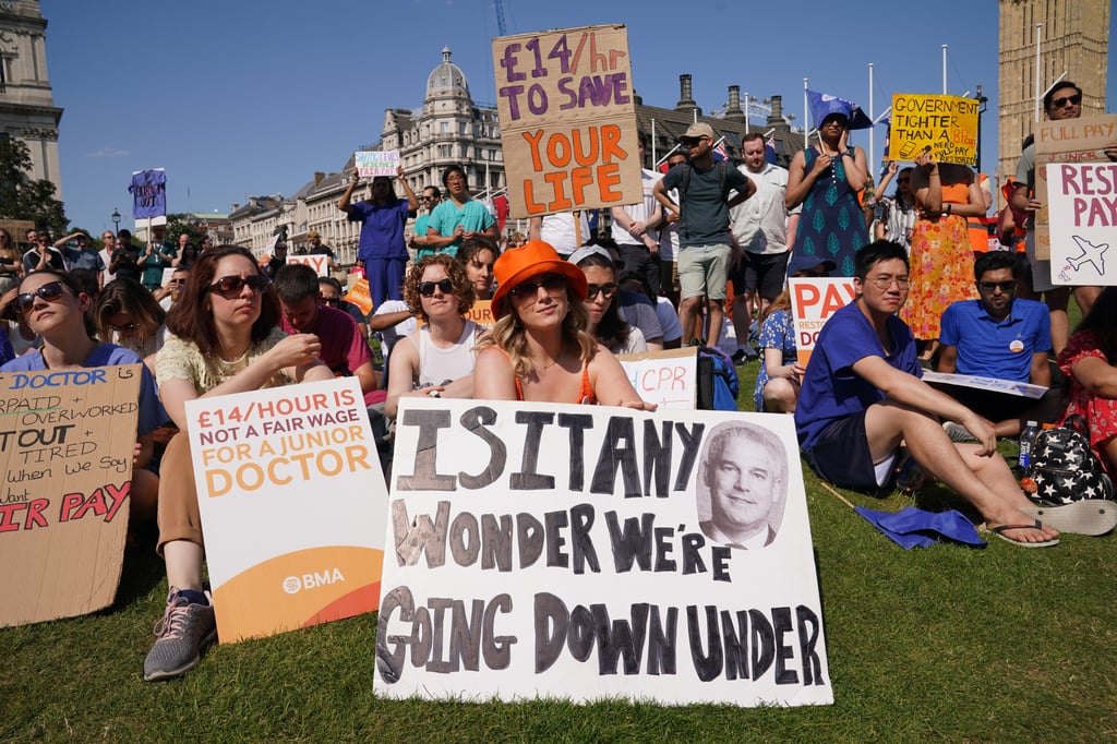 Striking junior doctors from British Medical Association take part in a rally in Parliament Square in London during a 72-hour stoppage in a row with the government over pay. Photo: DPA Striking junior doctors from British Medical Association take part in a rally in Parliament Square in London during a 72-hour stoppage in a row with the government over pay. Photo: DPA