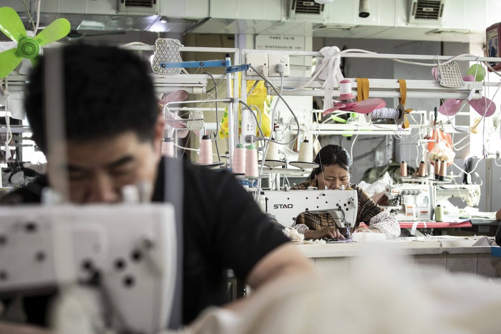 Workers at a garment factory in Guangzhou. China has vowed to intensify efforts to unleash the potential of artificial intelligence. Photo: Bloomberg