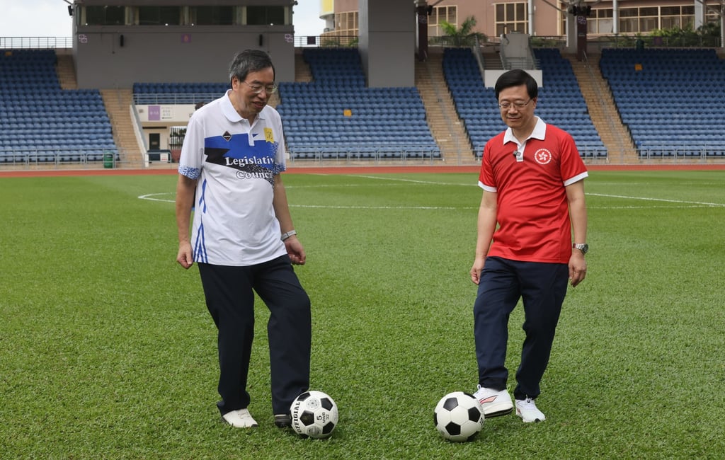 Legislative Council president Andrew Leung with John Lee at a football match with officials at Siu Sai Wan Sports Ground in May. Photo: Jonathan Wong