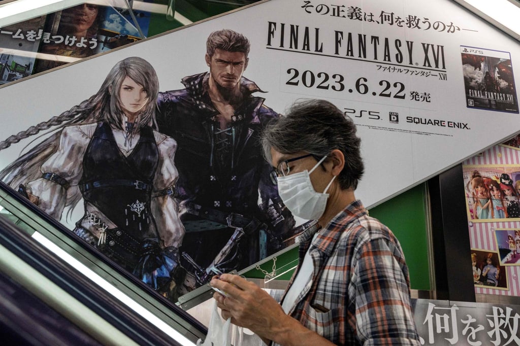A man rides an escalator past an advertisement for “Final Fantasy XVI”. Photo: AFP A man rides an escalator past an advertisement for “Final Fantasy XVI”. Photo: AFP