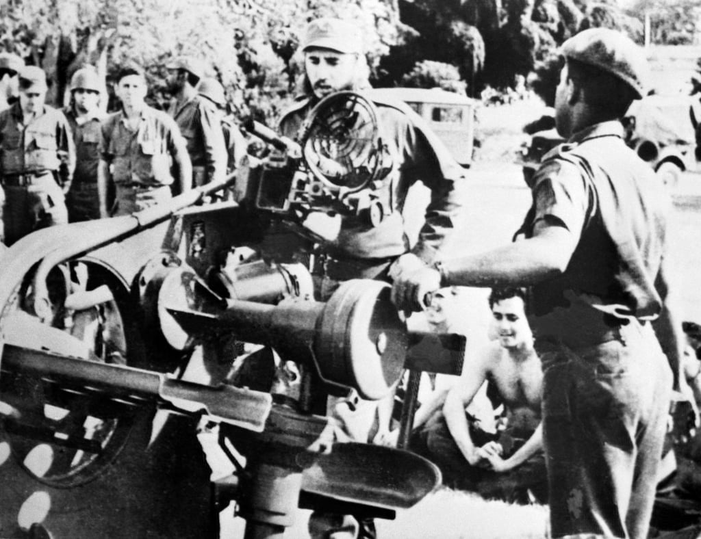 Cuban leader Fidel Castro (centre) inspects weapons at a military base on November 2, 1962, days after the missile crisis ended peacefully. Photo: AFP