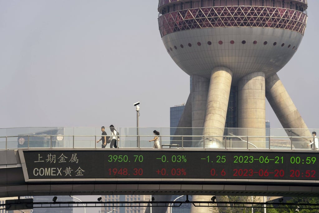 An electronic ticker displays stock figures in Pudong’s Lujiazui financial district in Shanghai, China. Photo: Bloomberg