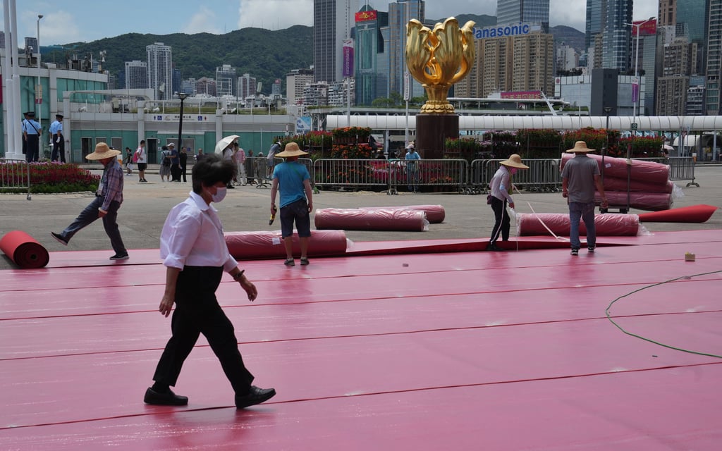 Workers set up the venue for a flag-raising ceremony at Golden Bauhinia Square on Saturday that will mark the 6th anniversary of the establishment of the Hong Kong Special Administrative Region. Photo: Elson Li Workers set up the venue for a flag-raising ceremony at Golden Bauhinia Square on Saturday that will mark the 6th anniversary of the establishment of the Hong Kong Special Administrative Region. Photo: Elson Li
