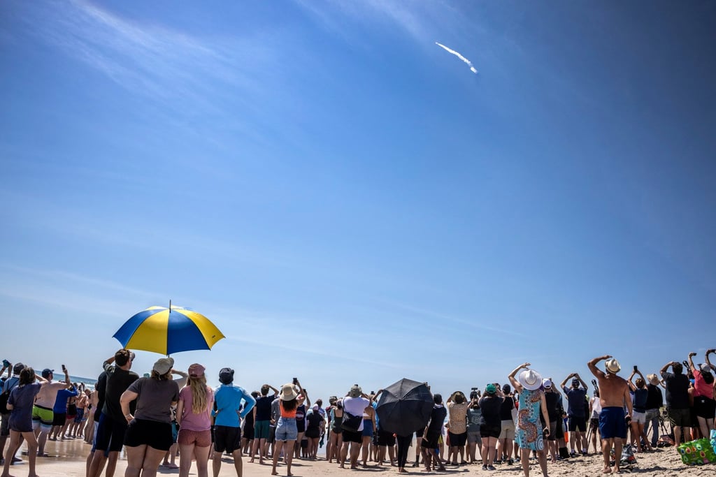 People observe from Playa Linda beach as the European Space Agency’s Euclid telescope mission lifts off on a SpaceX Falcon 9 rocket from Kennedy Space Centre in Florida on Saturday. Photo: EPA-EFE People observe from Playa Linda beach as the European Space Agency’s Euclid telescope mission lifts off on a SpaceX Falcon 9 rocket from Kennedy Space Centre in Florida on Saturday. Photo: EPA-EFE