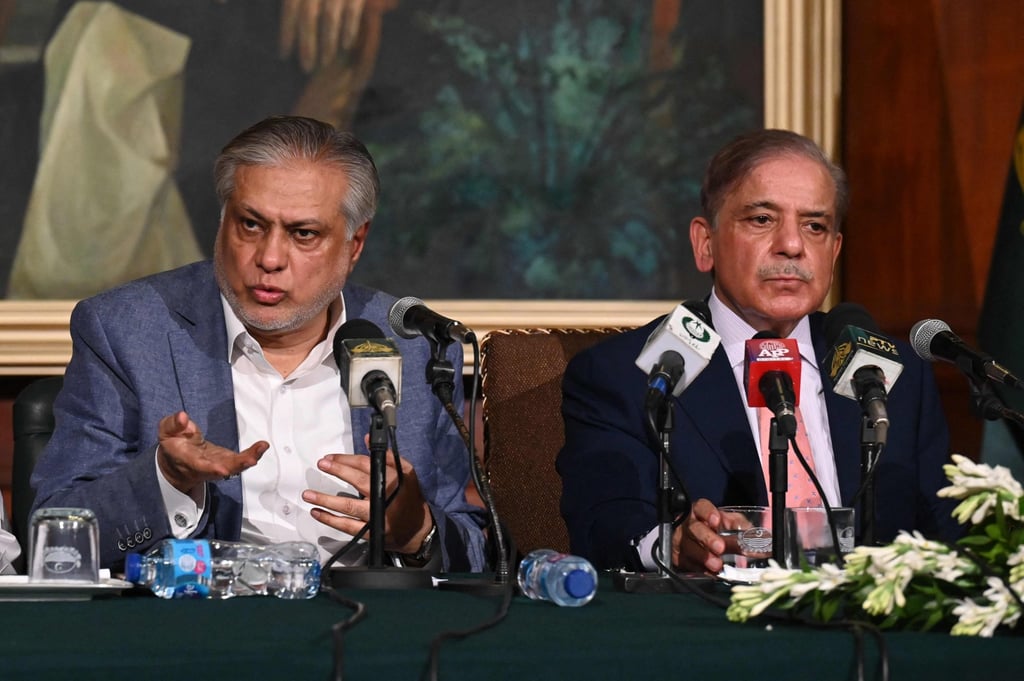 Pakistan’s Prime Minister Shehbaz Sharif (right) and Finance Minister Ishaq Dar in Lahore on June 30 after the signing of a staff-level agreement with the IMF. Photo: AFP