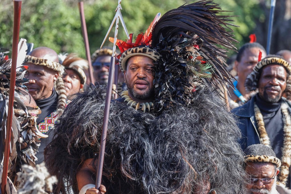 Zulu king Misuzulu Zulu, centre, holds a spear as he sings with Zulu regiments during his coronation near Durban, South Africa in August. Photo: AFP Zulu king Misuzulu Zulu, centre, holds a spear as he sings with Zulu regiments during his coronation near Durban, South Africa in August. Photo: AFP