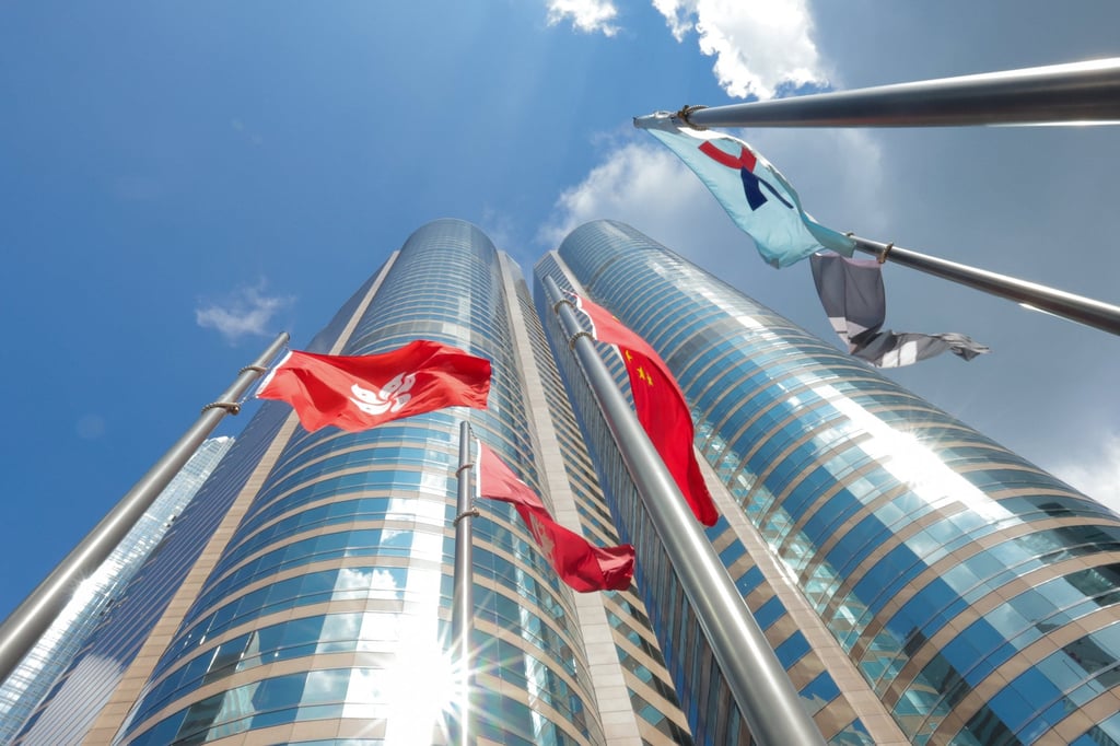 Flags are raised outside the Hong Kong Exchange Square building in Central of Hong Kong. Photo: Jelly Tse