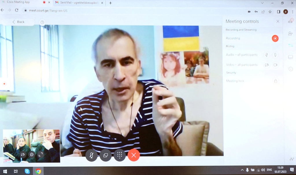 Georgia’s jailed ex-president Mikheil Saakashvili appears on a screen via a video link from a clinic during a court hearing in Tbilisi, Georgia on Monday. Photo: Reuters Georgia’s jailed ex-president Mikheil Saakashvili appears on a screen via a video link from a clinic during a court hearing in Tbilisi, Georgia on Monday. Photo: Reuters