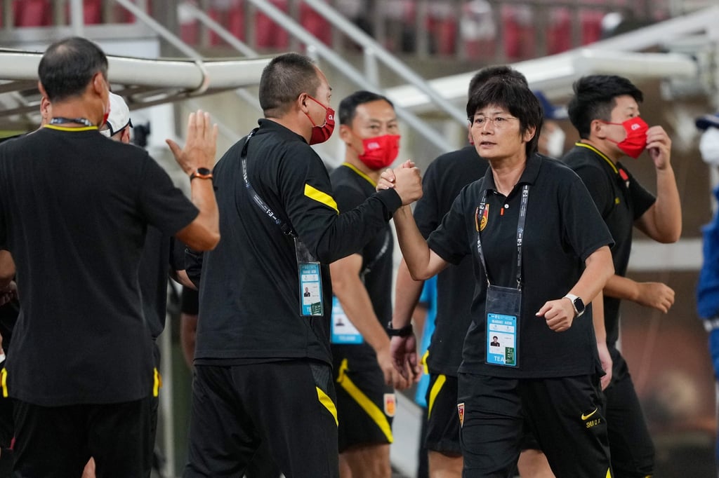Head coach Shui Qingxia (second from right) is aiming for the knockout stages of the tournament. Photo: Xinhua