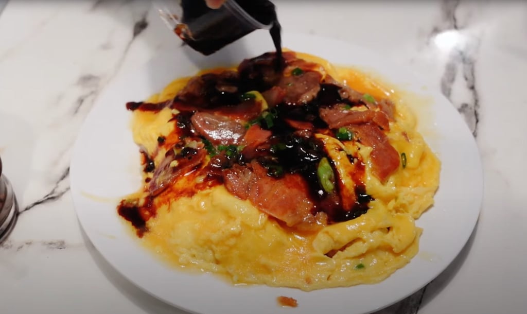 Char siu pork and egg rice at Shun Hing Restaurant. Photo: YouTube/@Humid with a Chance of Fishballs Tours Char siu pork and egg rice at Shun Hing Restaurant. Photo: YouTube/@Humid with a Chance of Fishballs Tours