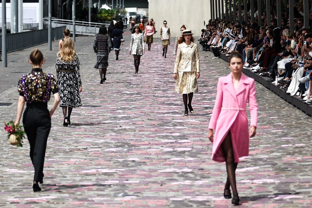 Models walk beside the Seine showing off creations for Chanel’s haute couture autumn/winter 2023/2024 collection on Tuesday. Photo: EPA-EFE Models walk beside the Seine showing off creations for Chanel’s haute couture autumn/winter 2023/2024 collection on Tuesday. Photo: EPA-EFE