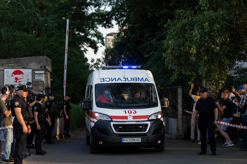 An ambulance leaves the Shevchenkivskyi courthouse after an explosive device was detonated at the building in Kyiv, Ukraine on Wednesday. Photo: AP