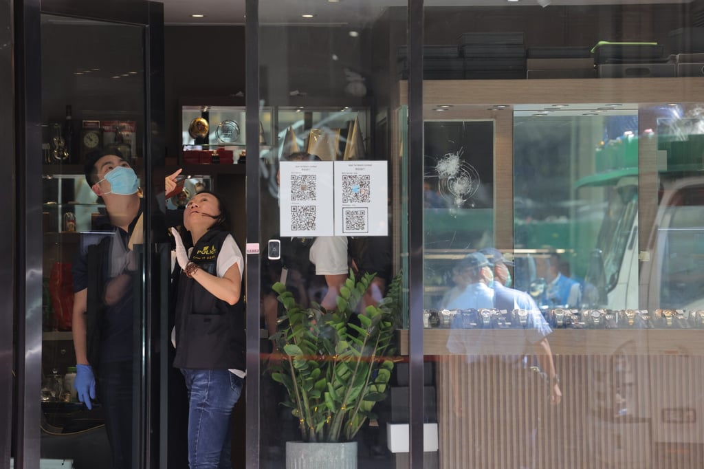 Police gather evidence at the Mody Road store after the robbery. Photo: Jelly Tse
