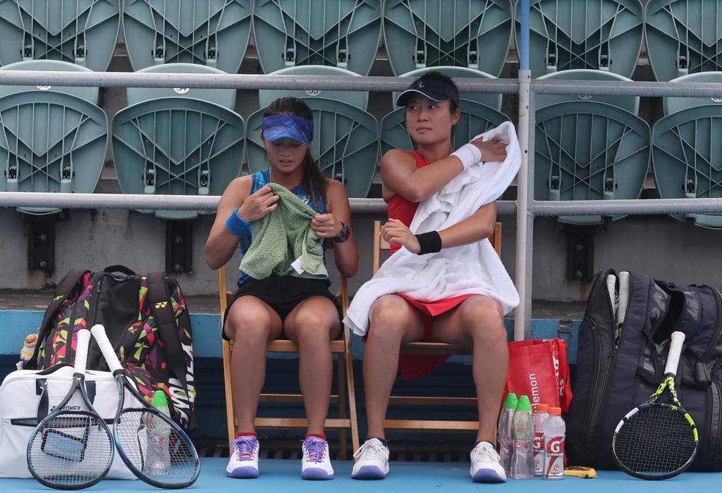Cody Wong (left) and Eudice Chong take a rest during their women’s doubles semi-final at Victoria Park Tennis Stadium. Photo: Edmond So