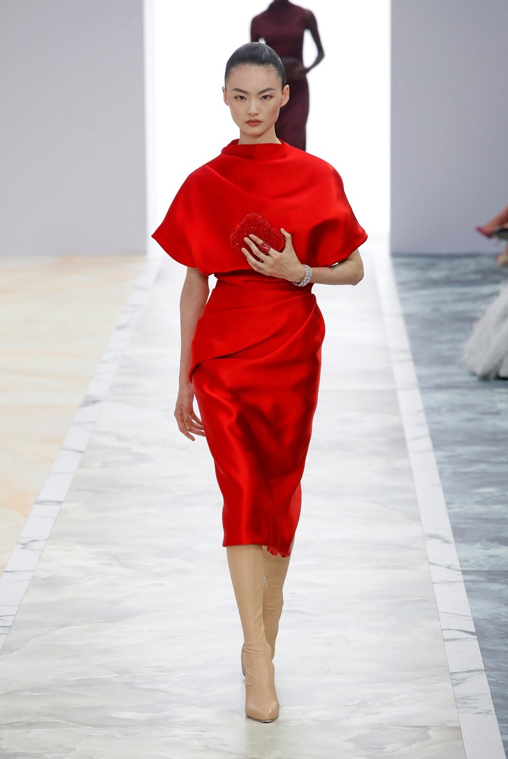 A model presents a vibrant, ruby red creation by Kim Jones at Fendi’s autumn/winter 2023/2024 haute couture show on July 6. Photo: Xinhua A model presents a vibrant, ruby red creation by Kim Jones at Fendi’s autumn/winter 2023/2024 haute couture show on July 6. Photo: Xinhua