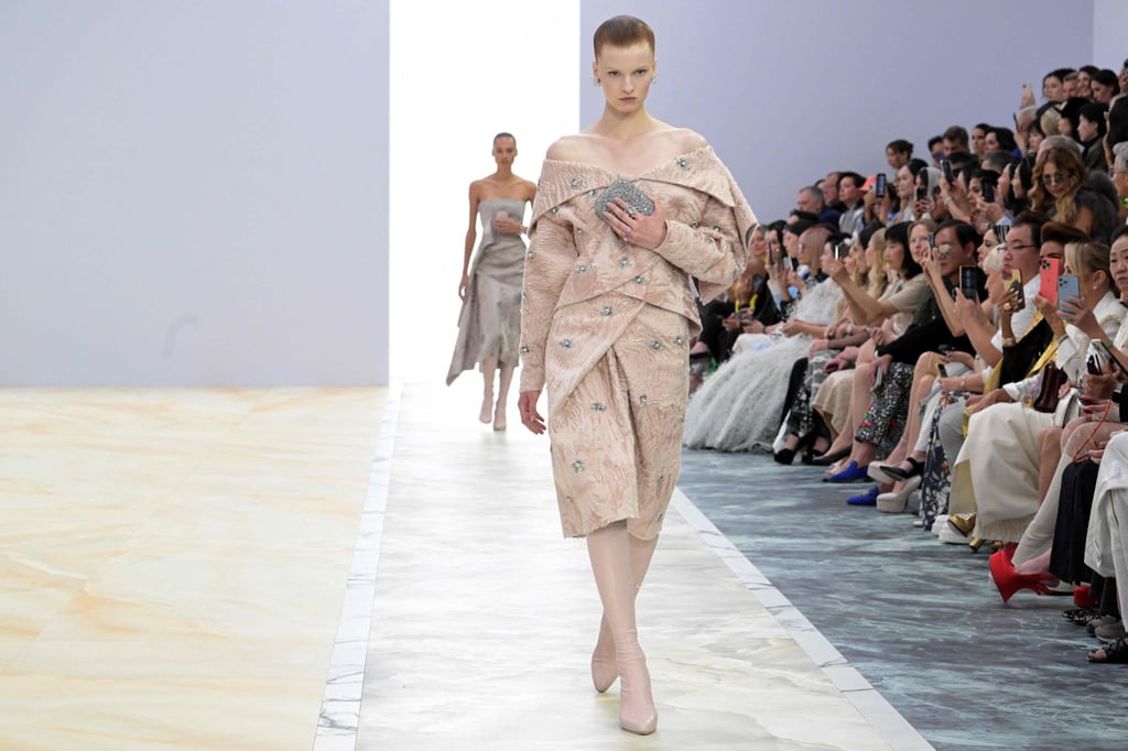 Kim Jones initially sent his models out in strikingly nude ensembles, before the jewel inspired collection began. Photo: AFP Kim Jones initially sent his models out in strikingly nude ensembles, before the jewel inspired collection began. Photo: AFP