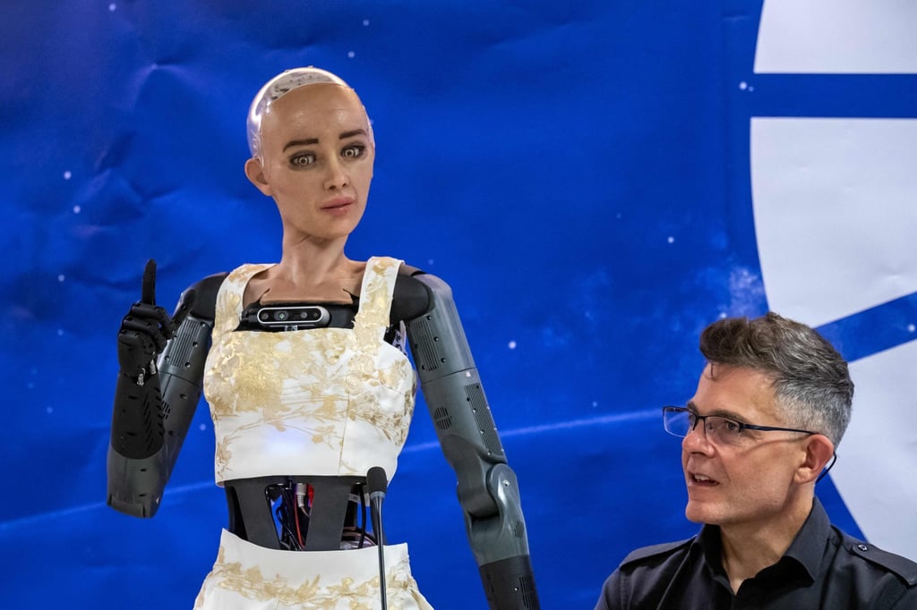 Hanson Robotics CEO David Hanson, right, listens to AI robot Sophia at the International Telecommunication Union (ITU) AI for Good Global Summit in Geneva, Switzerland on Friday. Photo: AFP Hanson Robotics CEO David Hanson, right, listens to AI robot Sophia at the International Telecommunication Union (ITU) AI for Good Global Summit in Geneva, Switzerland on Friday. Photo: AFP