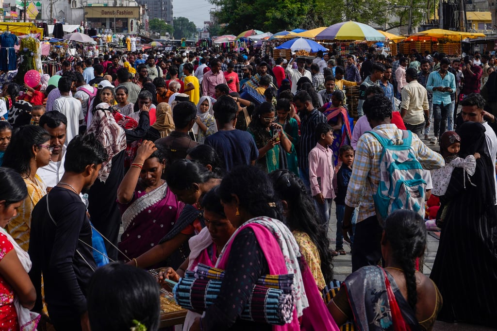 People crowd a street in Hyderabad on Monday. India recently overtook China to become the world’s most populous nation. Photo: AP People crowd a street in Hyderabad on Monday. India recently overtook China to become the world’s most populous nation. Photo: AP